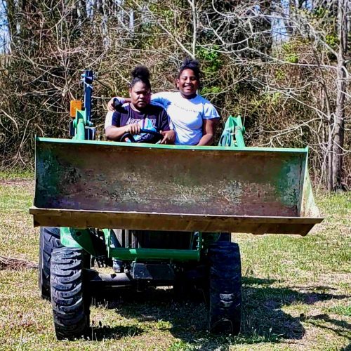 Shania & sis on tractor